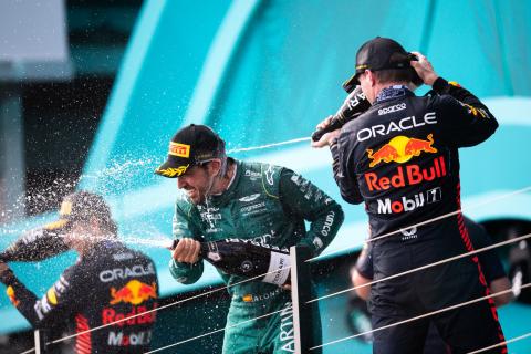 (L to R): Fernando Alonso (ESP) Aston Martin F1 Team celebrates his third position on the podium with race winner Max